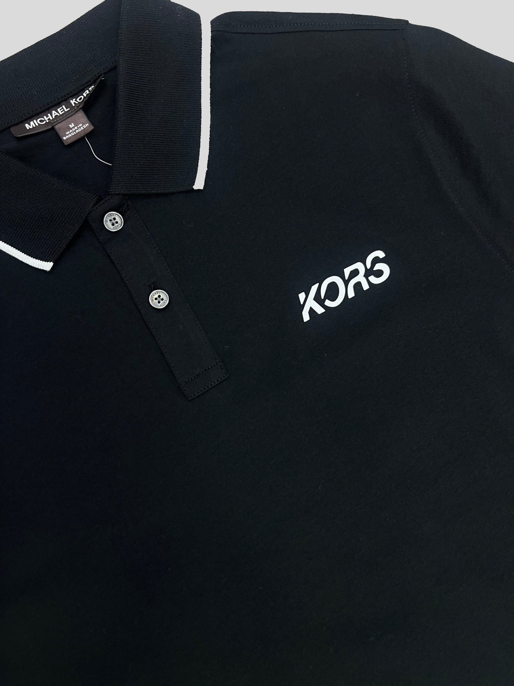 Polera Polo Michael Kors logo Kors/linea cuello  ‘Negra’