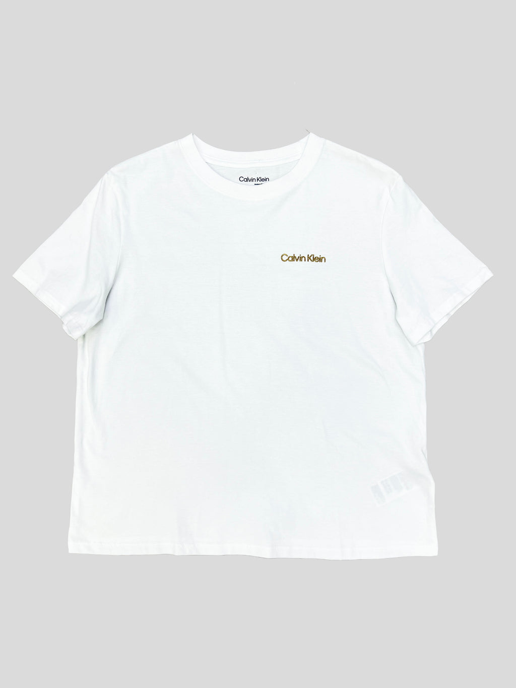 Polera Calvin Klein logo glitter dorado ‘Blanca’